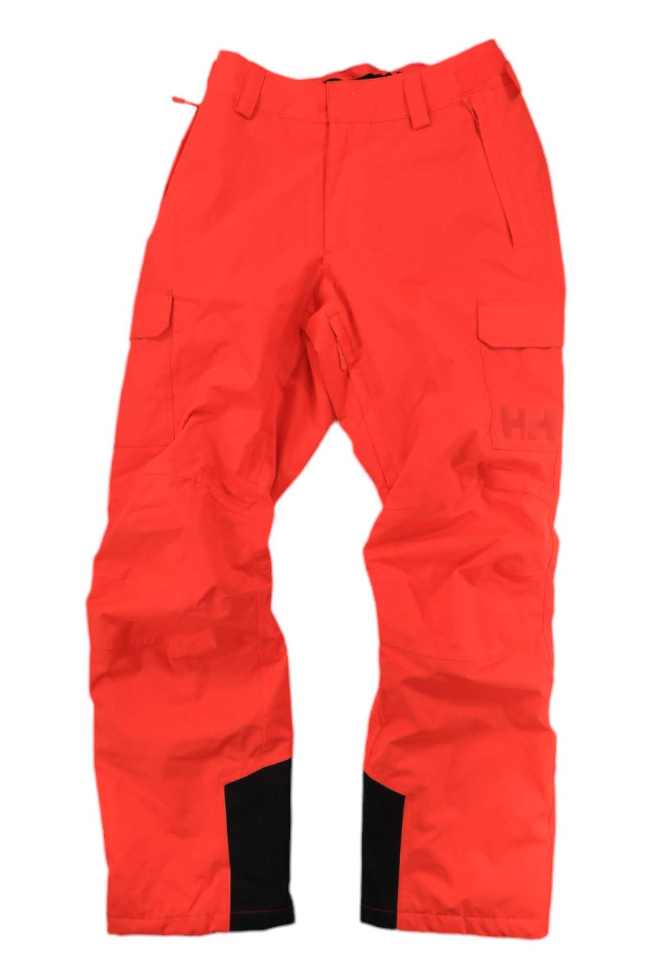 The Helly Hansen Womens Switch Cargo Insulated Pant in bright red features Primaloft insulation, multiple pockets, and black reinforced inner ankle patches. These waterproof ski pants are shown against a white background.