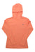The Huk Womens Waypoint Hoodie in peach features long sleeves for sun protection and a small left chest pocket with a subtle tag, shown laid flat.
