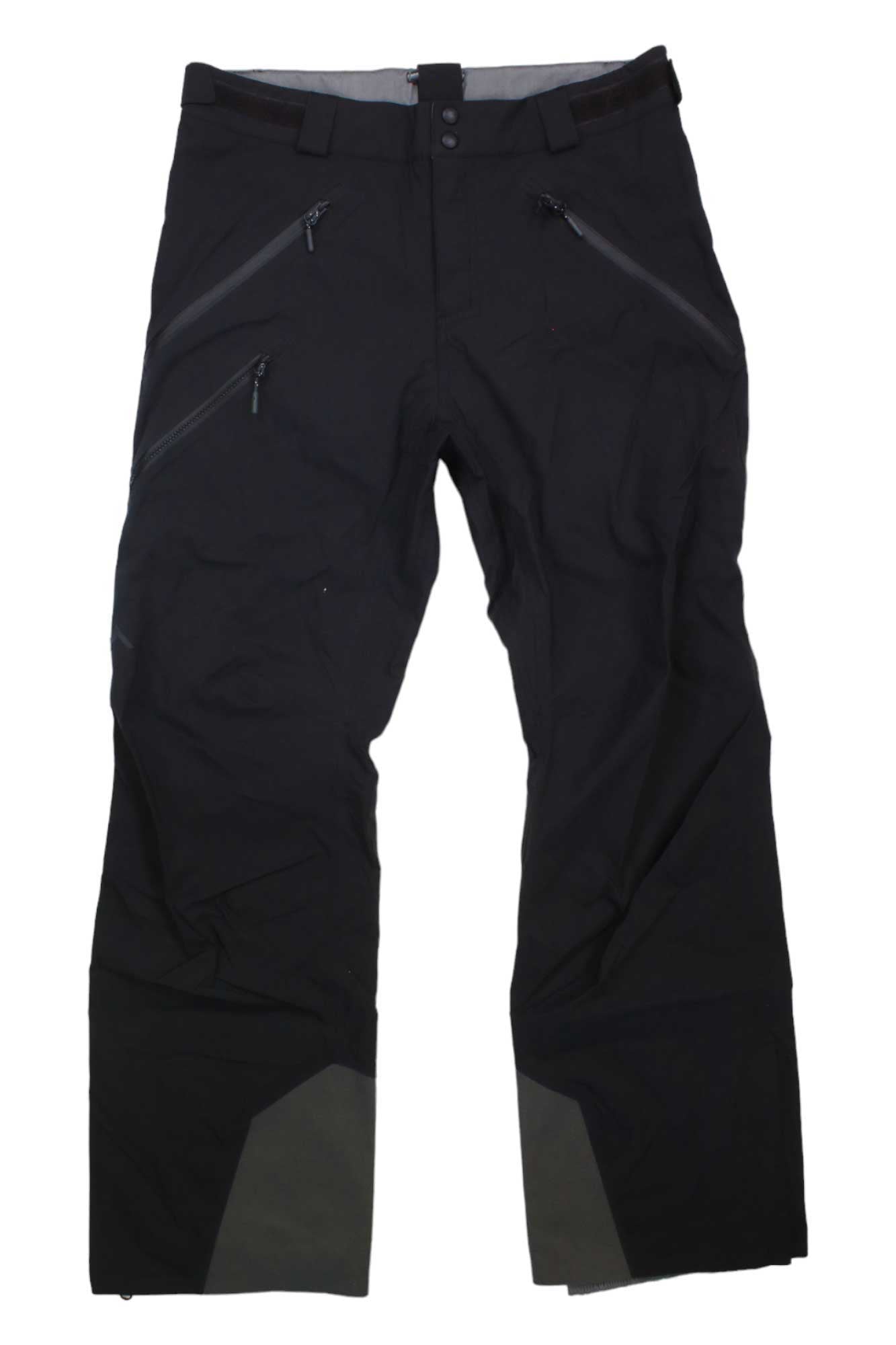 The Strafe Mens Capitol Pant, black with 4-way stretch, multiple zippered pockets, ankle reinforcement, and a button waist closure, is shown laid flat on a white background.