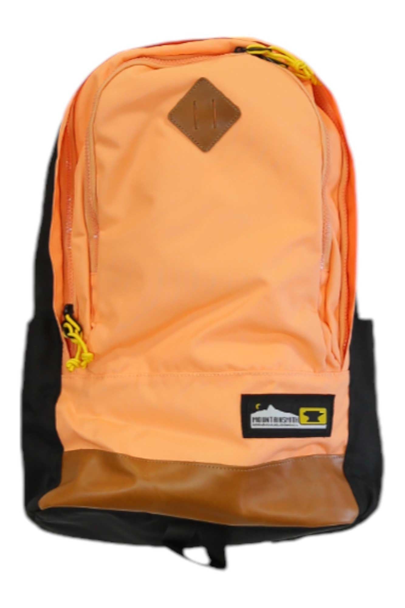 Salmon Mountainsmith Trippin Pack backpack with front logo patch, zip pocket, brown base