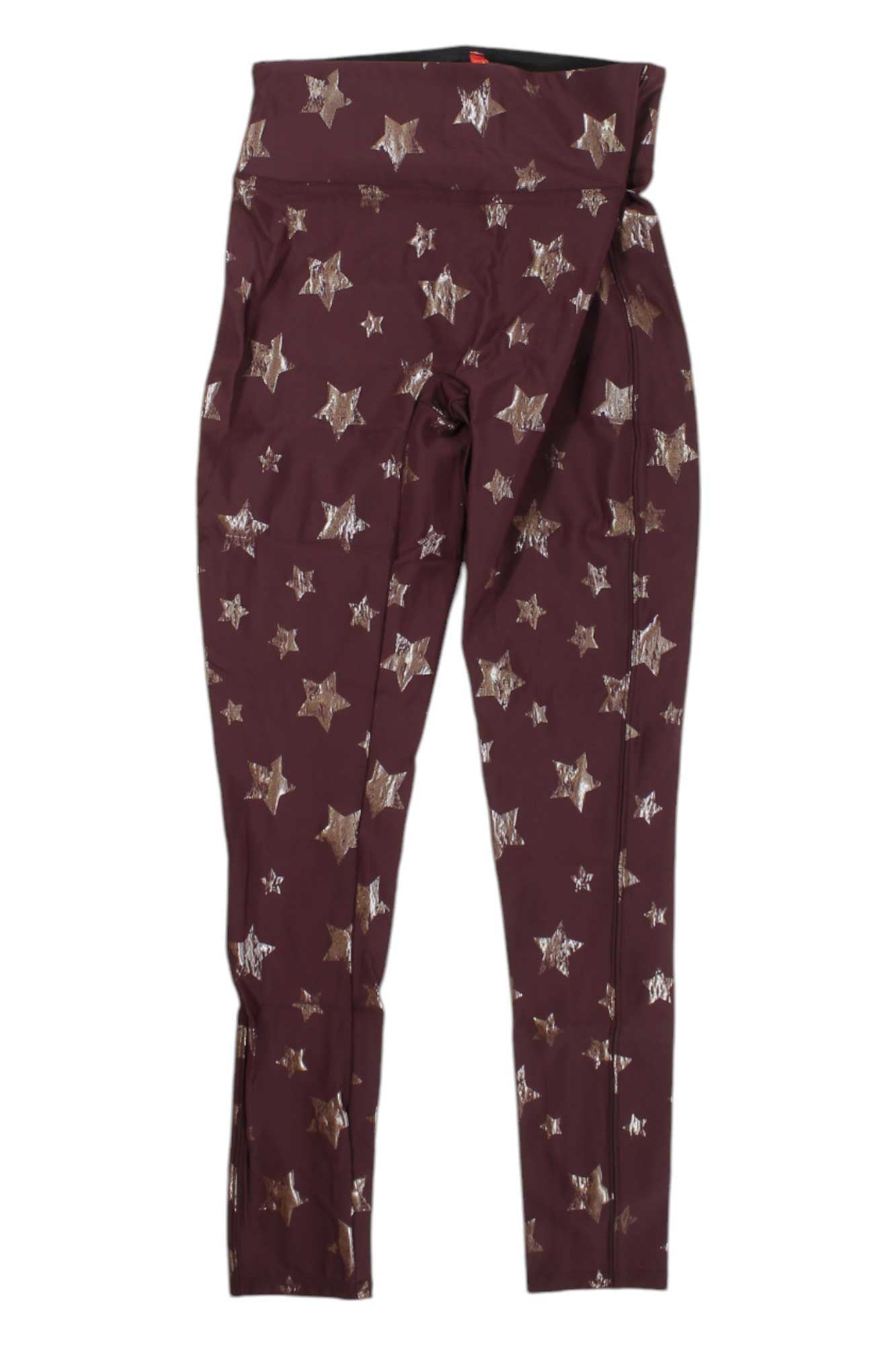 Spanx Girl's Faux Leather Star Legging in maroon features a metallic silver star pattern and a folded waistband for a trendy look, shown flat on a white background.