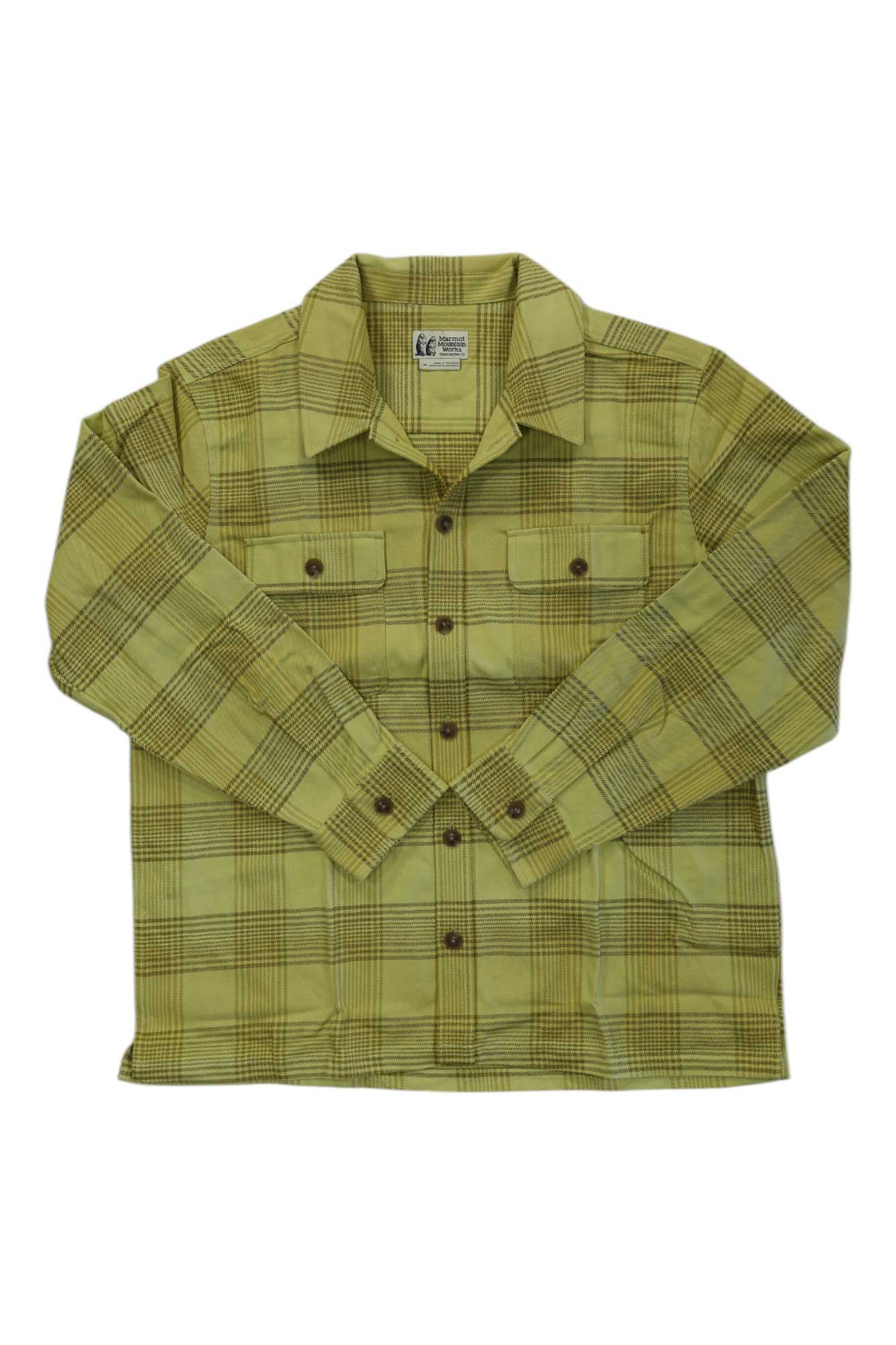 The Marmot Mens Incline Heavyweight Flannel LS Shirt features a yellow and brown plaid, two button-flap chest pockets, and a collar. Laid flat on a white background, this warm shirt is ideal for cool weather.