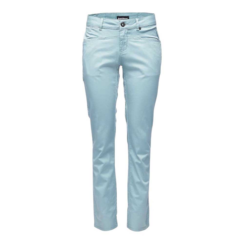 The Black Diamond Womens Radha Pant, slim-fit light blue hiking pants for women with front pockets, belt loops, and a button and zipper closure, is displayed against a white background.