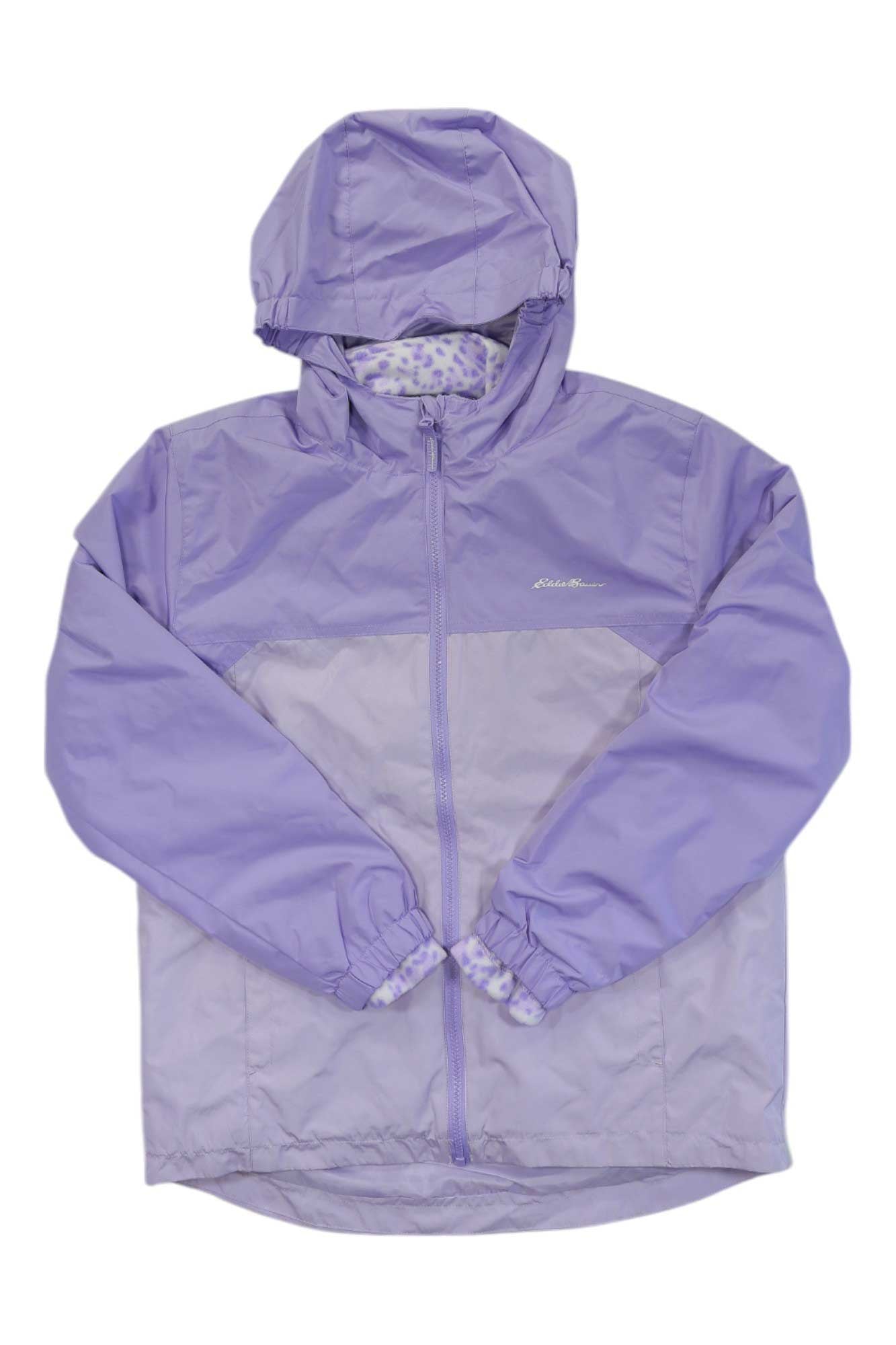 The Eddie Bauer Girls Lone Peak 3-In-1 Jacket is light purple, features a front zipper, elastic cuffs, and has a subtle patterned lining visible at the collar.