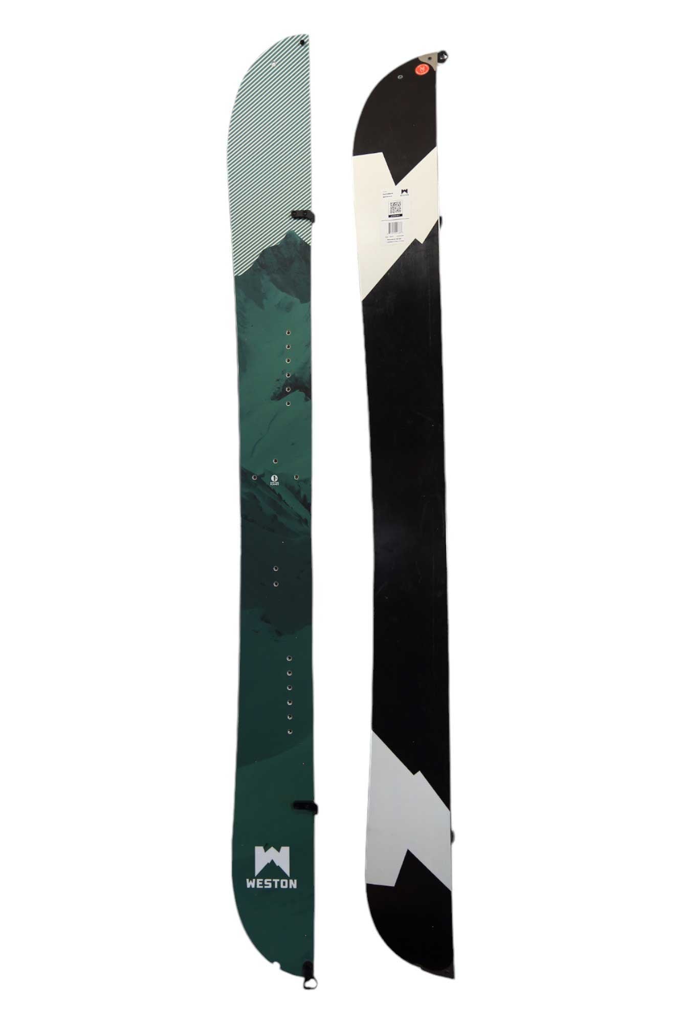 The Weston Switchback Splitboard is shown split in half: one side displays a mountain graphic with "WESTON," while the other features a black and white geometric design—ideal for backcountry freeride camber adventures.