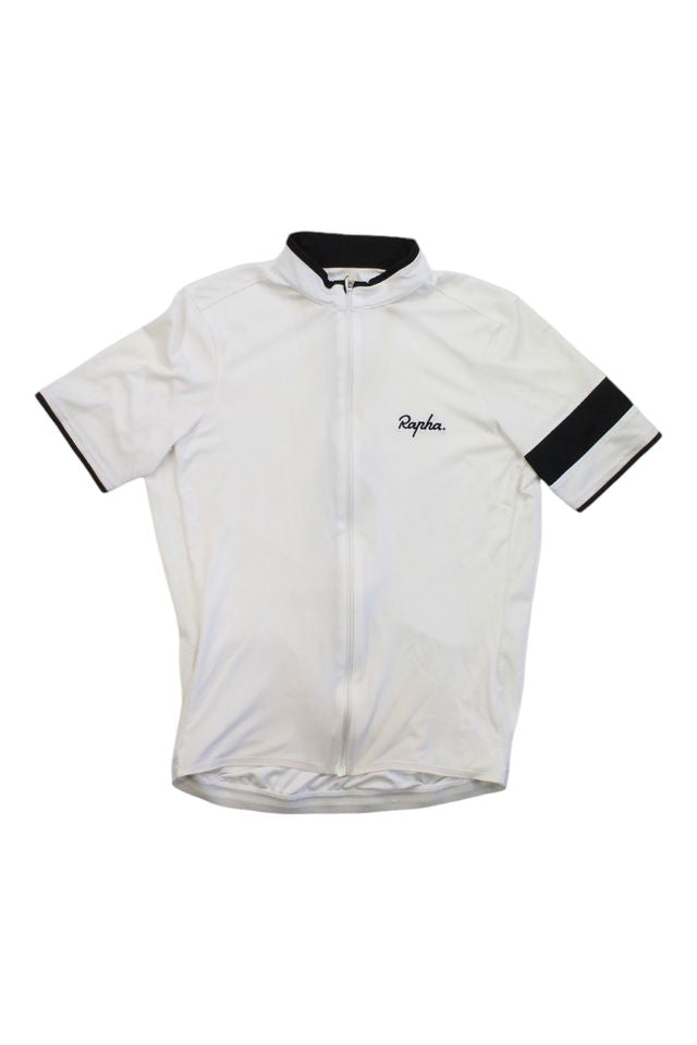 The Rapha Mens Super Lightweight Jersey is a white short-sleeve cycling jersey with a black collar, a black stripe on the left sleeve, the Rapha logo on the chest, and a front zipper.