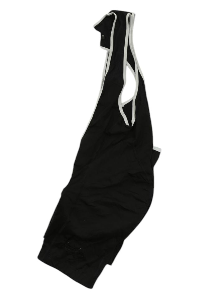 Black sleeveless athletic singlet with white trim, made from stretchy men's cycling apparel material. Perfect for pairing with Mens Bib Shorts for sports such as wrestling or cycling. Displayed flat on a white background.