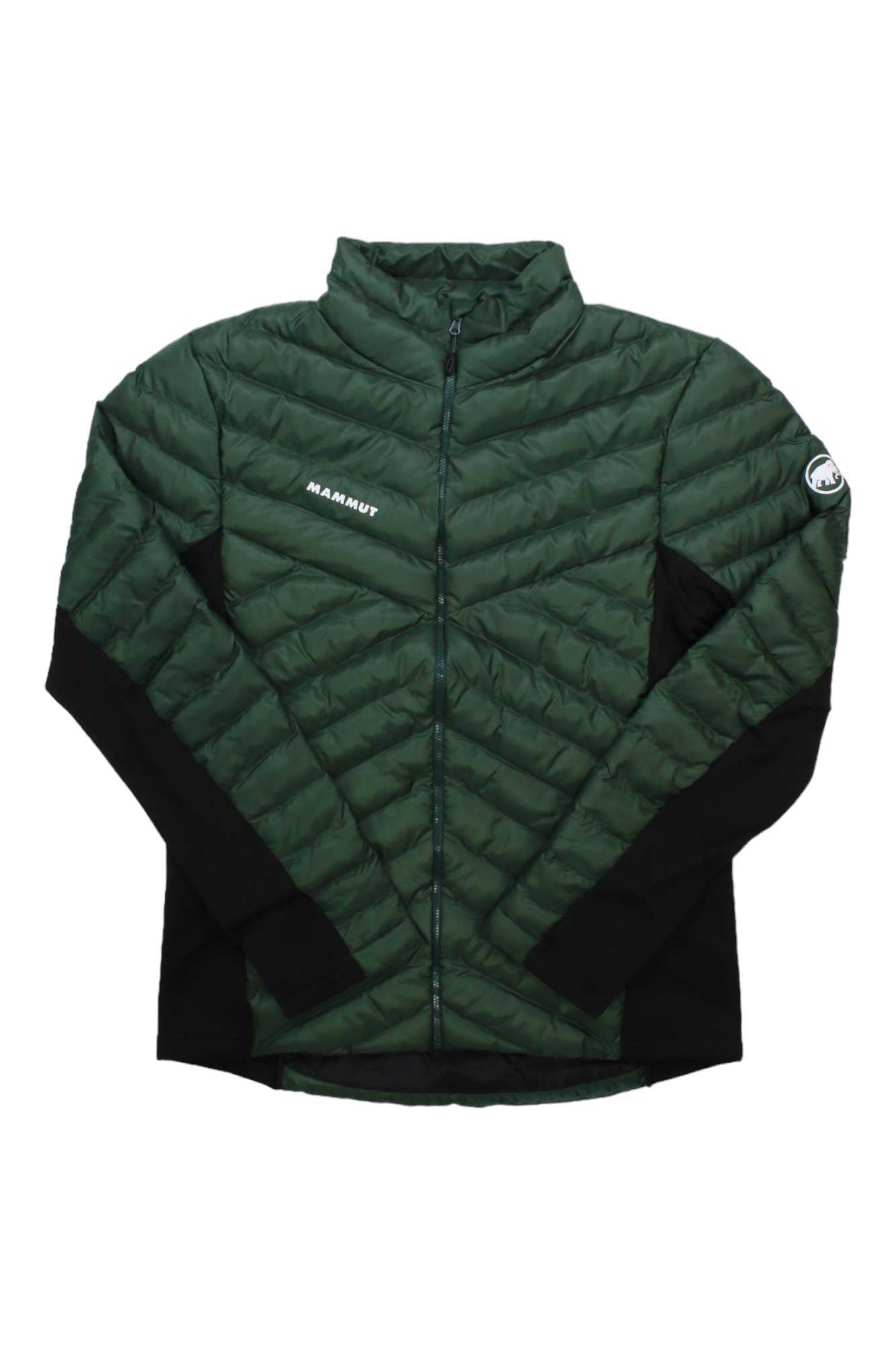 The Mammut Men's Albula IN Hybrid Jacket is a green quilted hiking jacket with black side panels, front zipper, high collar, MAMMUT logo on the left chest, a round patch on the left sleeve, and synthetic vegan down insulation.