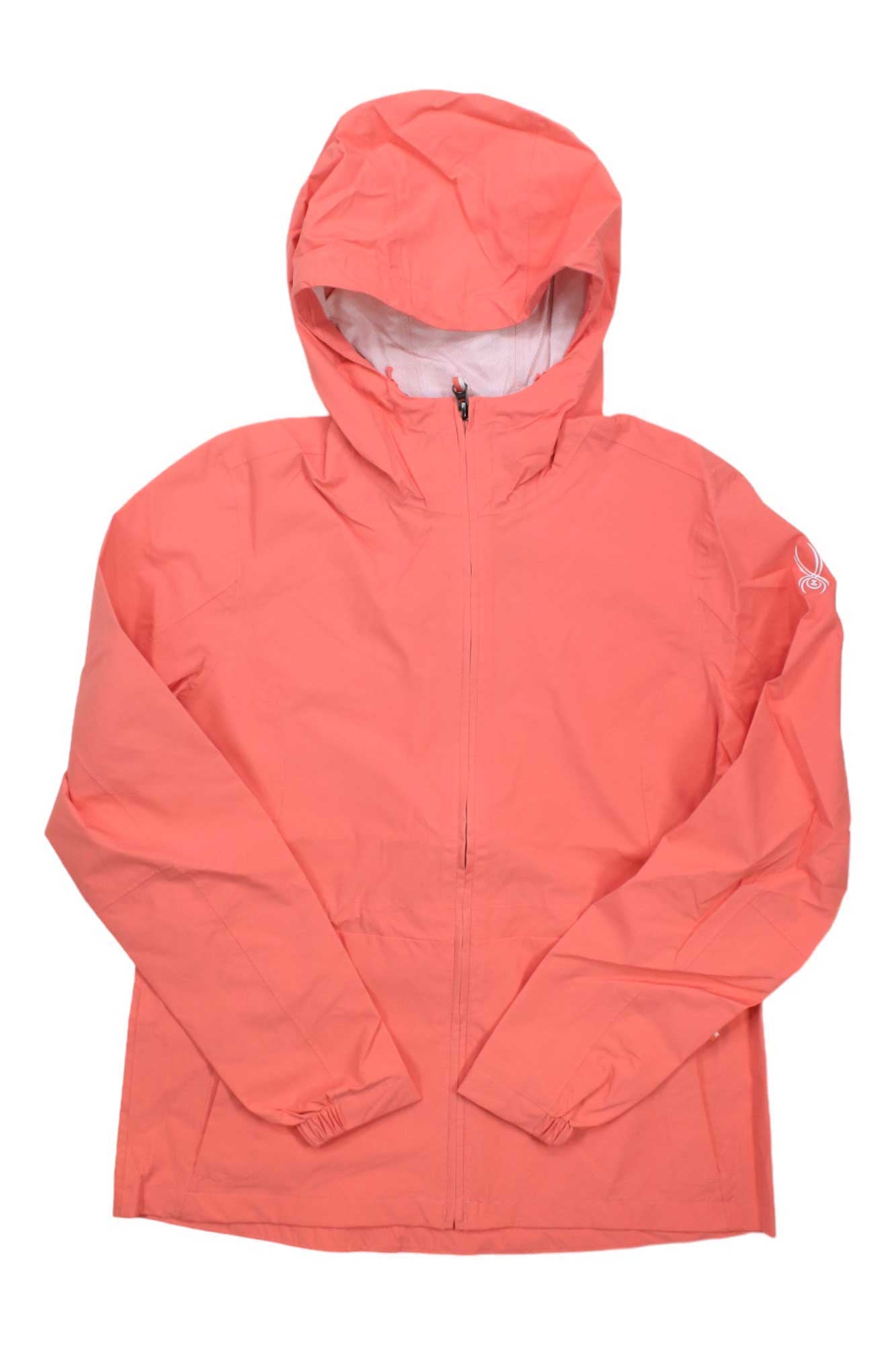 The Spyder Womens Misty Rain is a coral pink rain jacket with a hood, front zipper, long sleeves, elasticized hem and cuffs. Water-resistant and packable, it features a small white logo on the upper left sleeve.