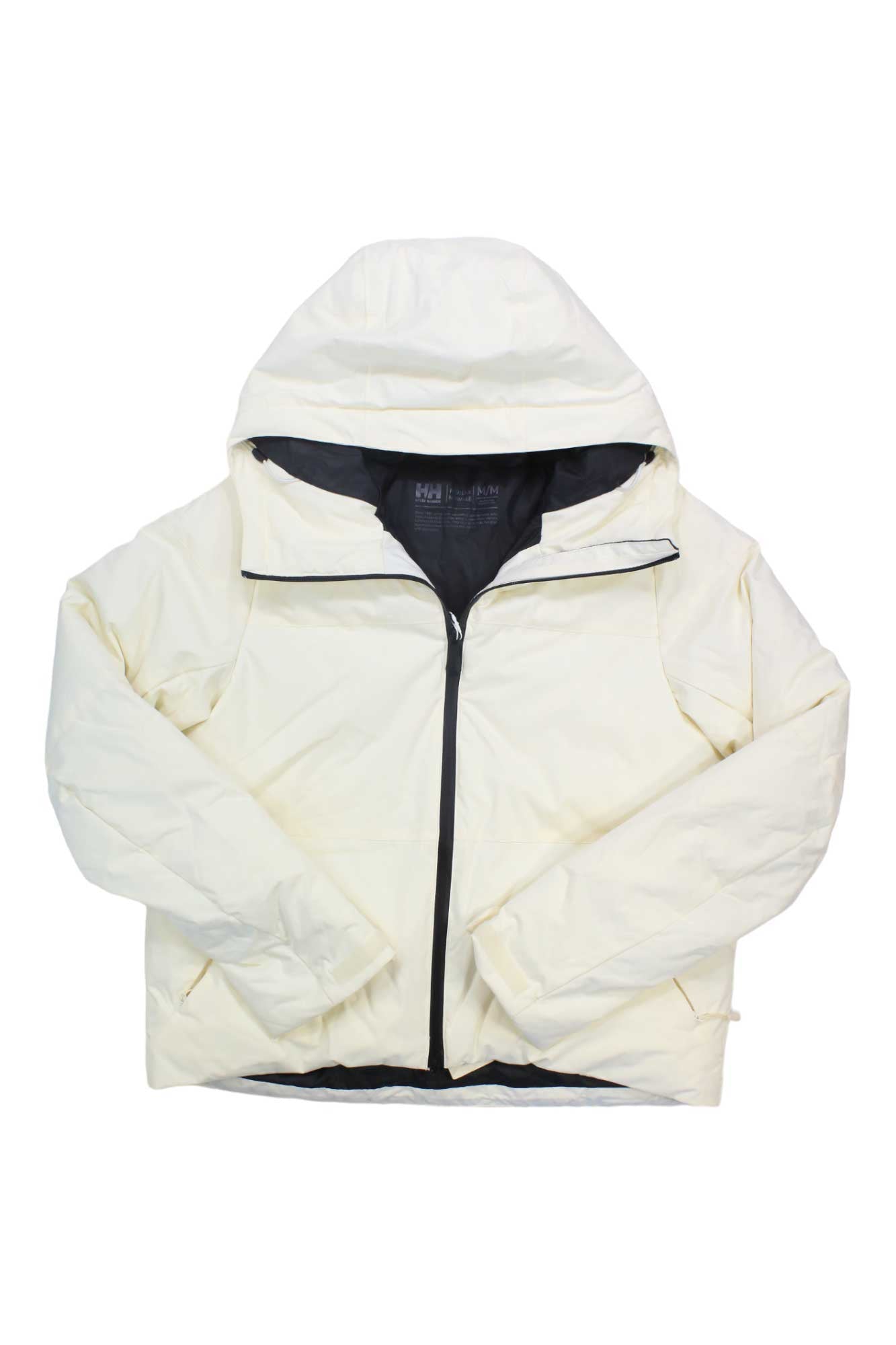 The Helly Hansen Womens Nora Short Puffy Jacket in white features a front zipper, black interior lining, and an adjustable hood, shown laid flat on a white background.