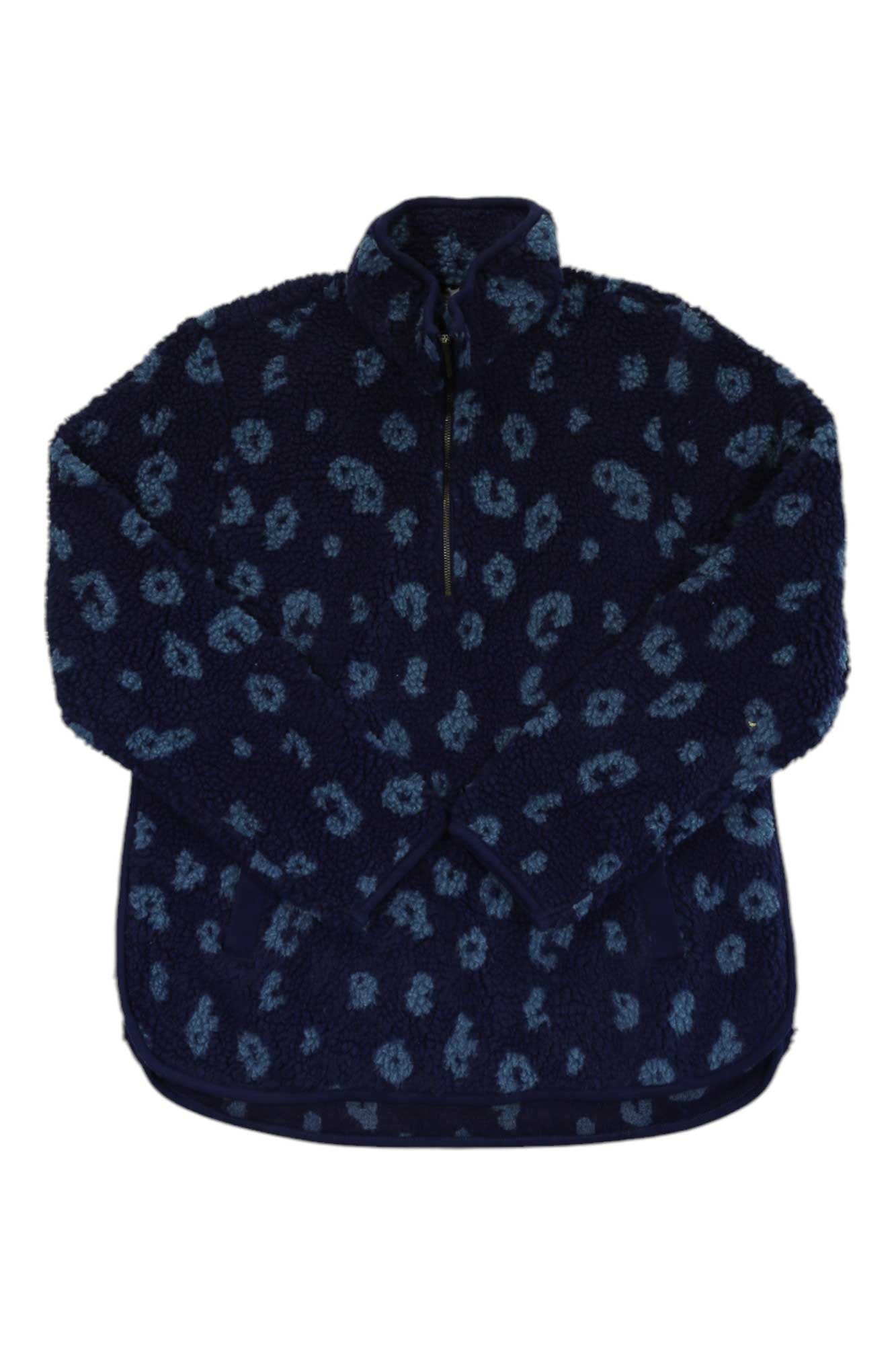 The Carve Designs Women's Westport Jacquard Tunic is a navy blue sherpa fleece pullover with a half-zip front, light blue leopard print, high collar, and long sleeves—an ideal cozy travel shirt for chilly days.