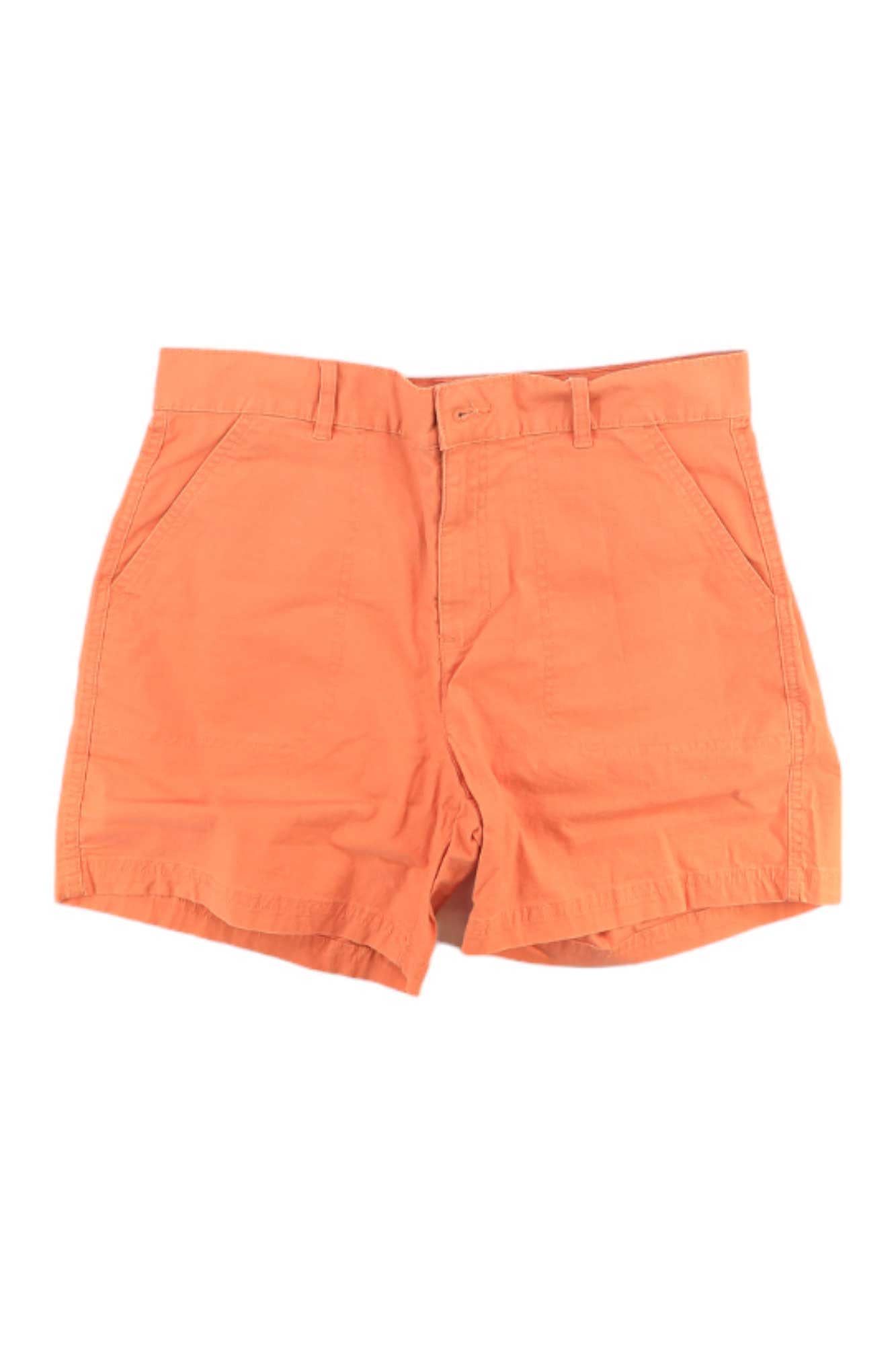 The Eddie Bauer Women's Adventure Ripstop 5 Inch Short in orange features belt loops, a front button and zipper closure, and two front pockets, shown laid flat on a white background.