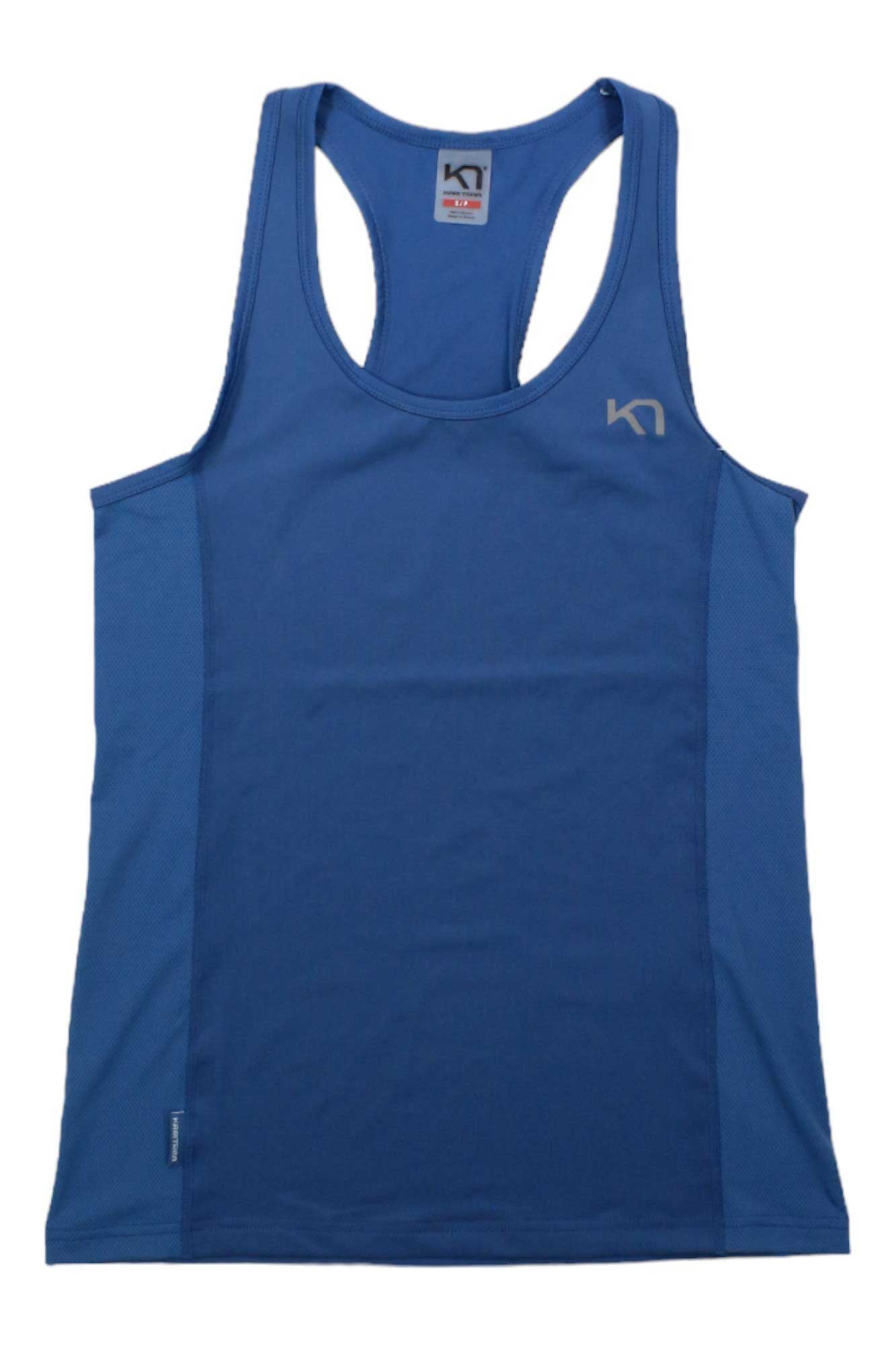 The Kari Traa Womens Nora SingleT Top is a blue sleeveless racerback with 4-way stretch fabric for comfort, a small left chest logo, quick-drying material, and an inner collar tag—perfect for athletic wear.