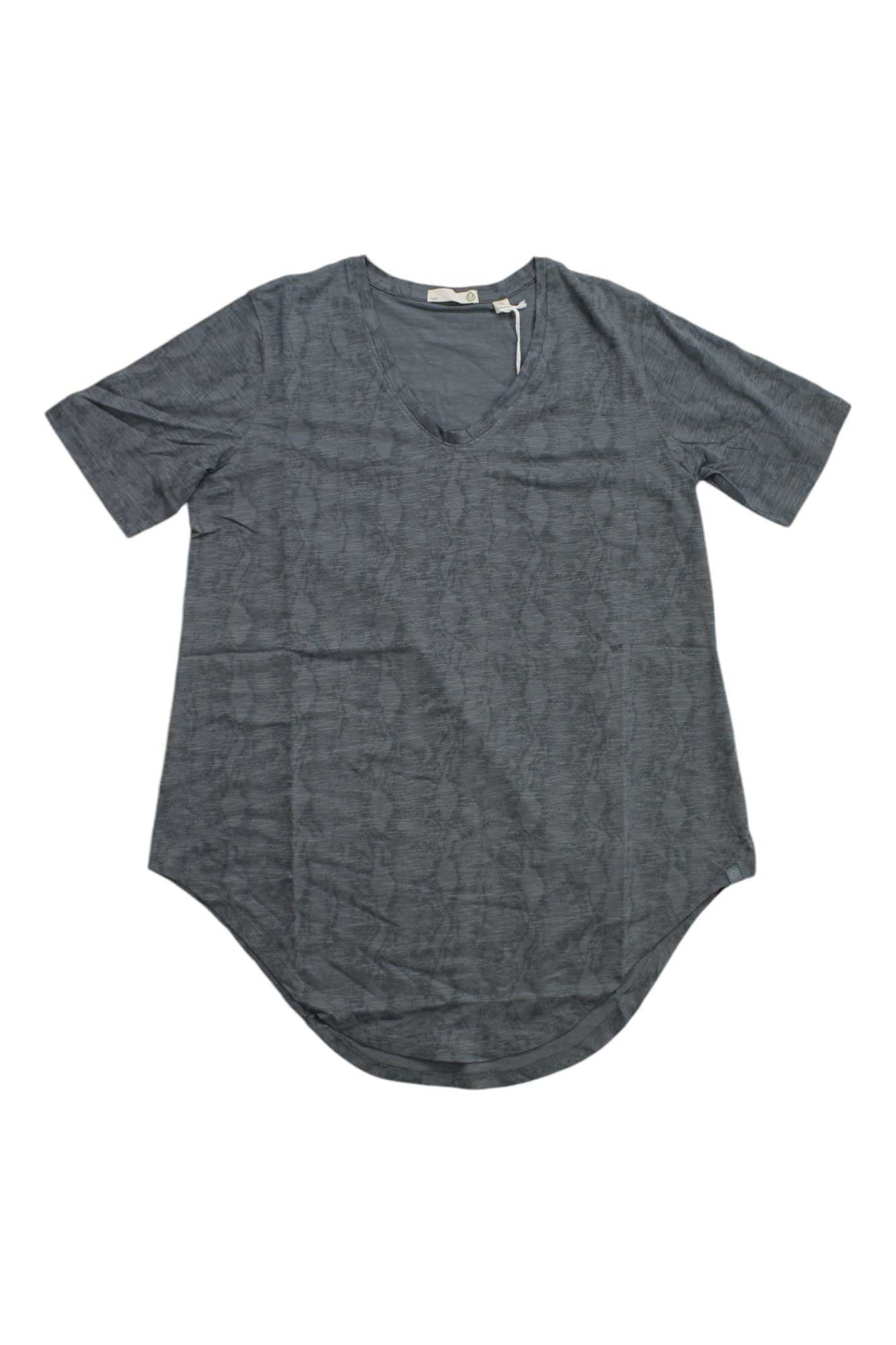 The Tasc Women's Longsline T-Shirt - Printed features short sleeves, a dark gray hue, subtle textured pattern, moisture-wicking fabric, and a curved hem, shown laid flat on a white background.