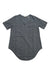 The Tasc Women's Longsline T-Shirt - Printed features short sleeves, a dark gray hue, subtle textured pattern, moisture-wicking fabric, and a curved hem, shown laid flat on a white background.