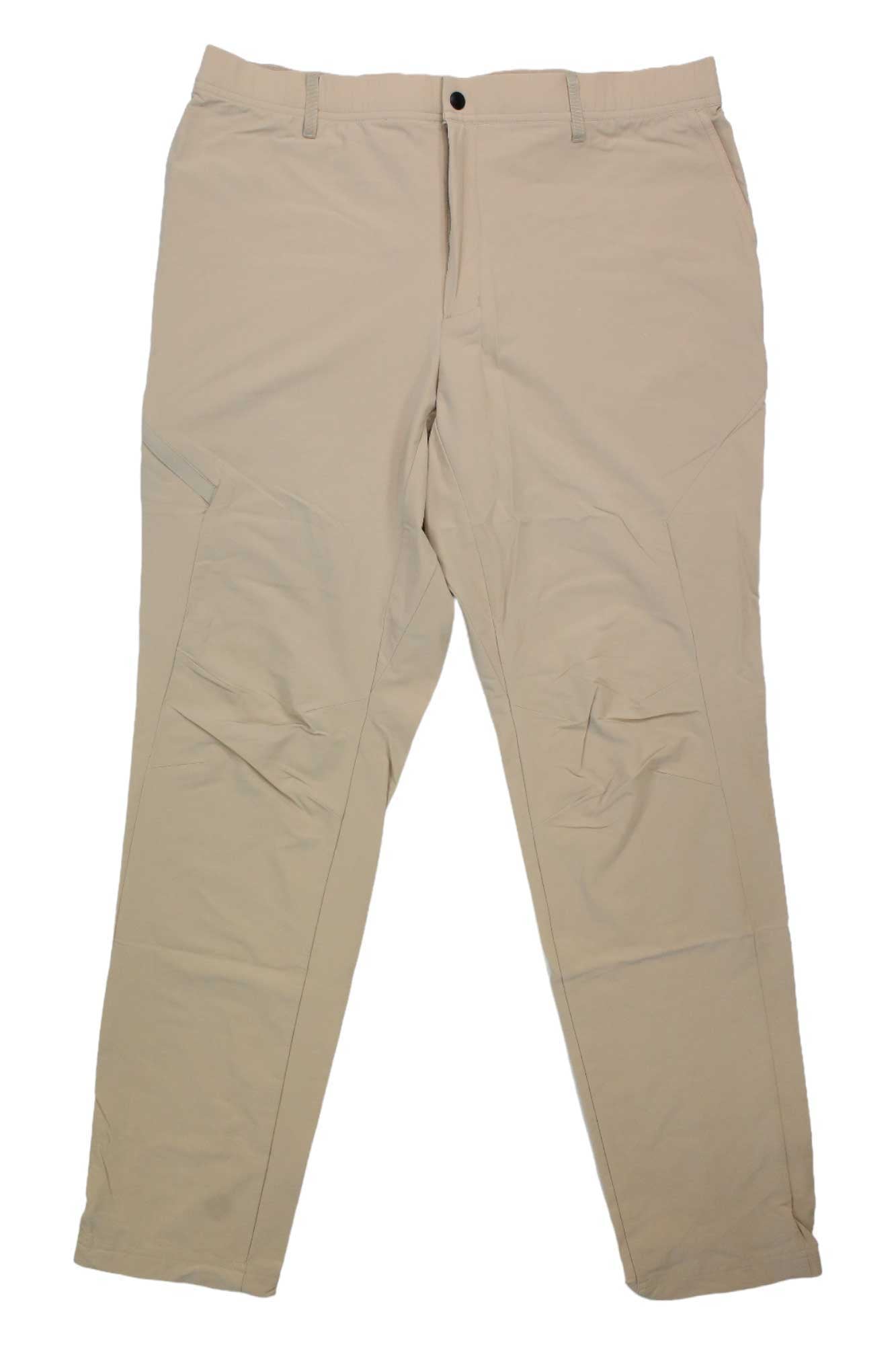 Orvis Men's Pro Skiff Pant in beige features straight legs, belt loops, button closure, visible knee stitching, and is made from DWR-coated stretch nylon with UPF 50 sun protection. Shown laid flat on a white background.