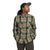 A person wearing The North Face Mens Valley Twill Flannel Shirt in green plaid, with brown pants and a green cap, stands hands-in-pockets, looking to the side against a plain white background.