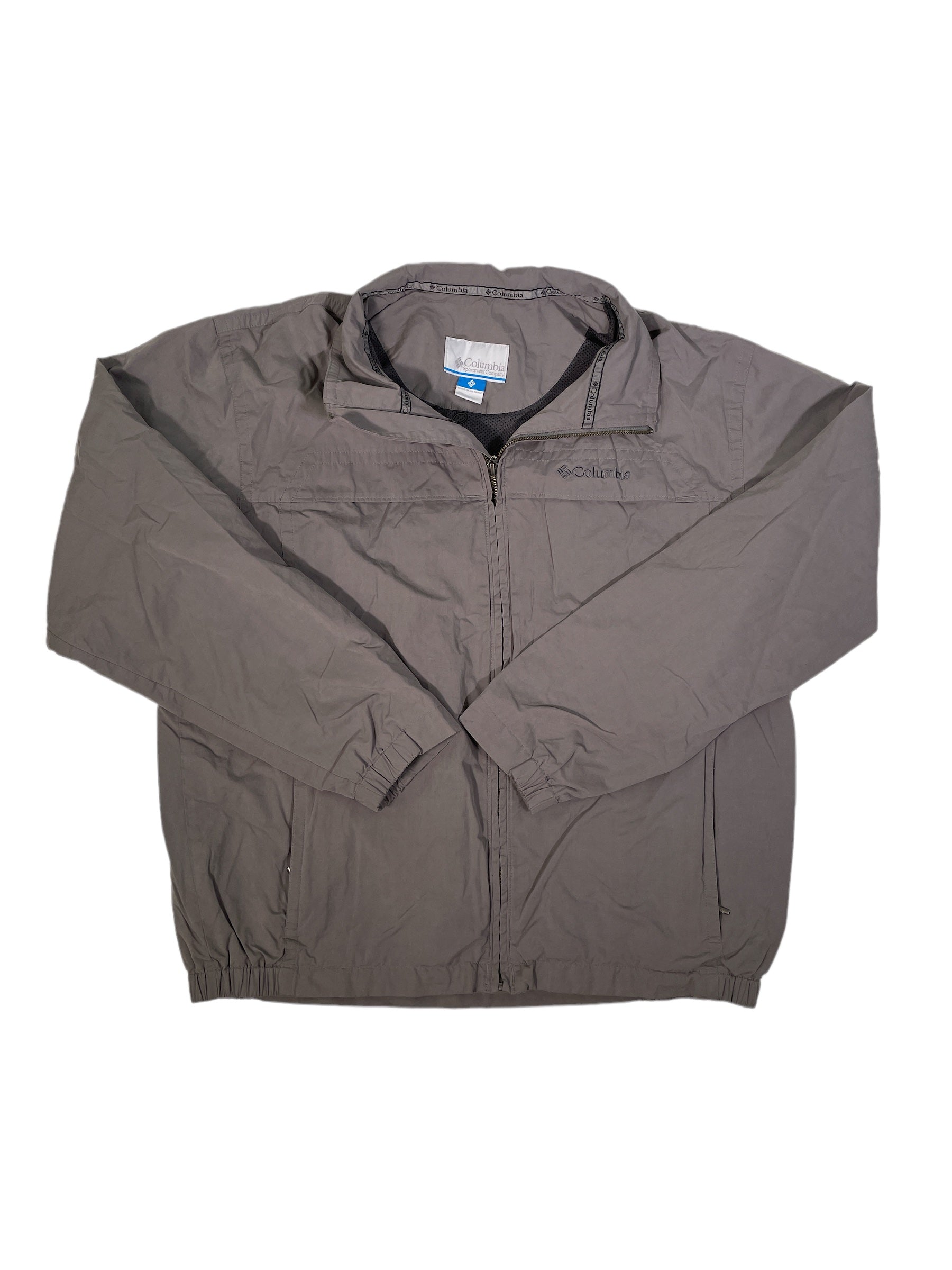 The Men's Softshell Jacket in gray by Columbia features a zip front, long sleeves, zippered pockets, and a stand-up collar. It is displayed flat on a white background.