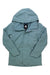The Burton Womens Jet Ridge Jacket is a light blue shell laid flat with the front zipper partially open, revealing a black and white mountain logo on the inner tag. This lightweight, long-sleeve hiking jacket includes a chest pocket for outdoor adventures.