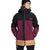 A young man in a black beanie and The North Face Mens Thermoball Eco Snow Triclimate Jacket in black, maroon, and tan stands against a white background.