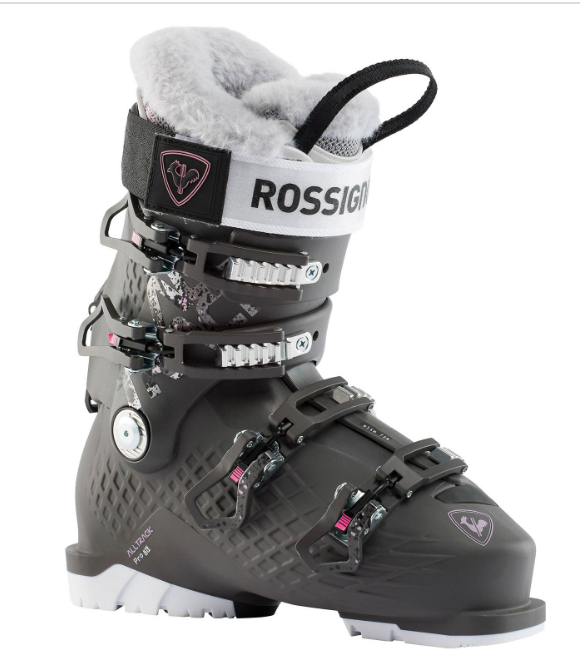 The Rossignol Alltrack Pro 80W 22/23 is a black ski boot with silver buckles, furry gray lining, and branded strap, designed for all-mountain performance and downhill skiing.