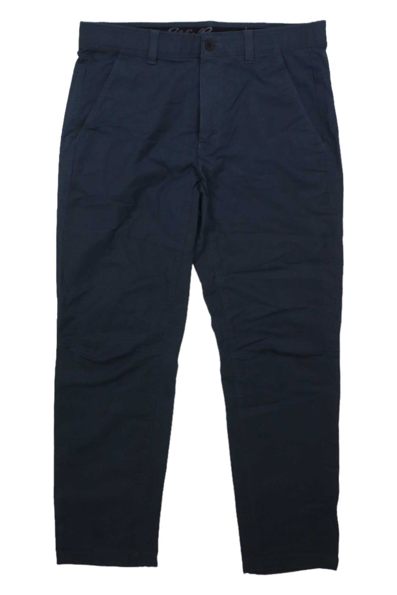 The Eddie Bauer Men's Voyager Flex Chino - Slim, in navy blue, features front pockets, a button closure, and belt loops; displayed flat on a white background.
