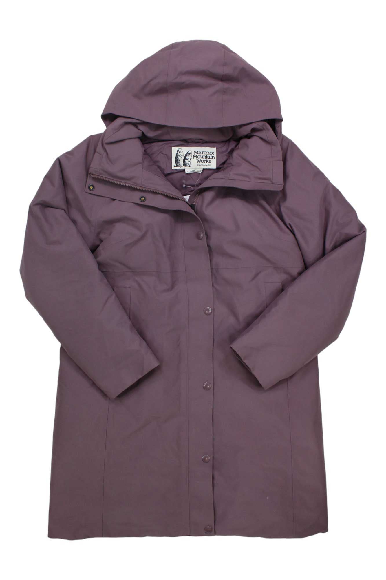 The Womens Chelsea Coat in mauve features a hood, snap buttons, and long sleeves. Crafted from recycled materials, it is shown laid flat on a white background with the inner label visible near the collar.