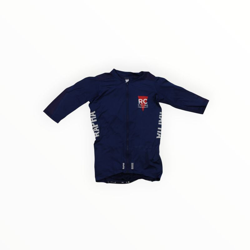 The Pro Team Aero Jersey II is a navy blue short-sleeved cycling jersey featuring a front zipper, white side text, and a red and white RC logo on the left chest, displayed flat on a white background.