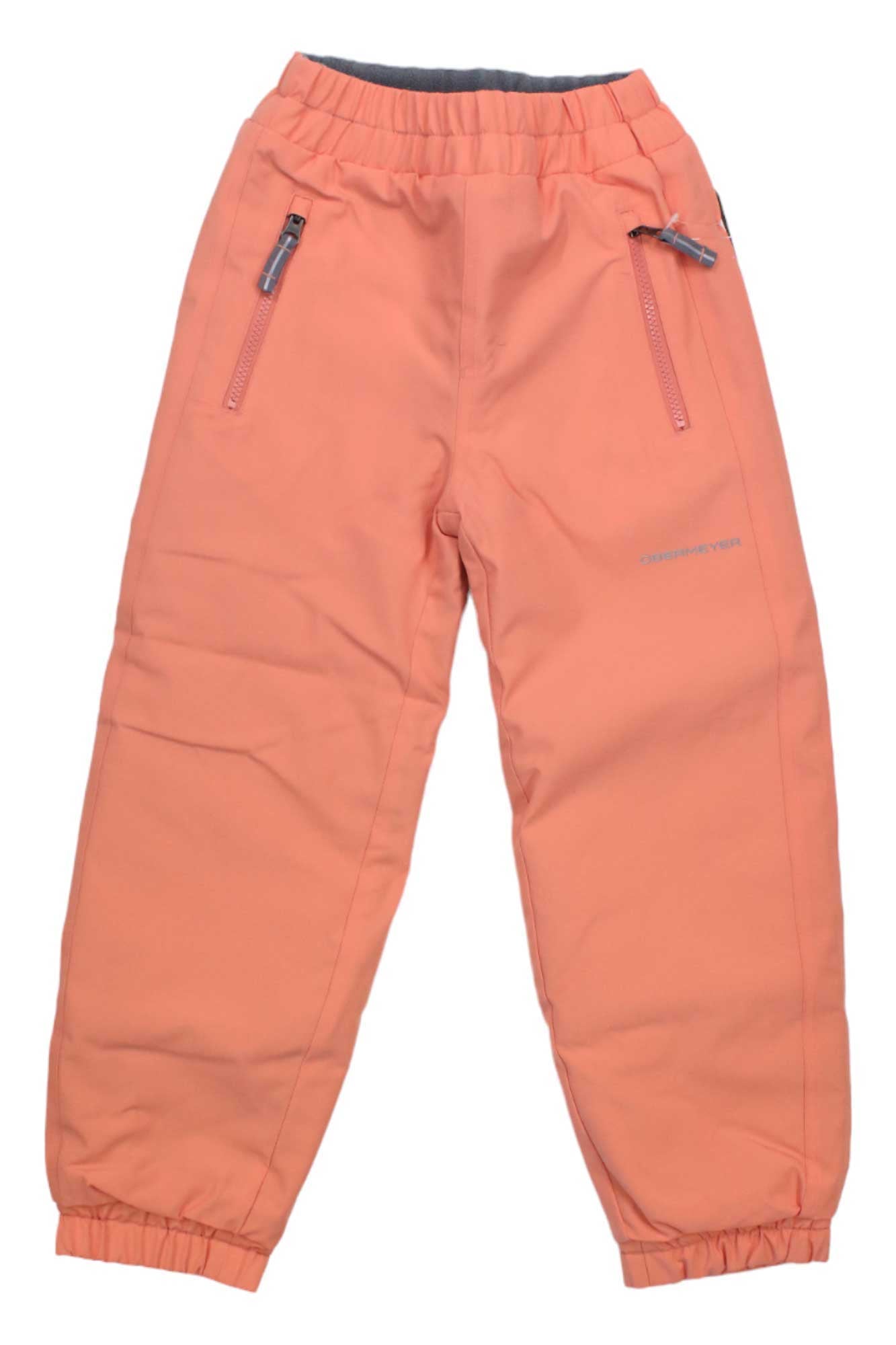 The Obermeyer Kids Campbell Pant is a peach-colored, insulated, and waterproof ski pant with an elastic waistband, zippered side pockets, and elastic ankle cuffs—perfect for active children. Displayed against a white background.
