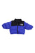 The North Face Infant 1996 Retro Nuptse Down Jacket is a blue and black puffer with a front zipper and left chest logo, designed as a cozy winter coat for babies.
