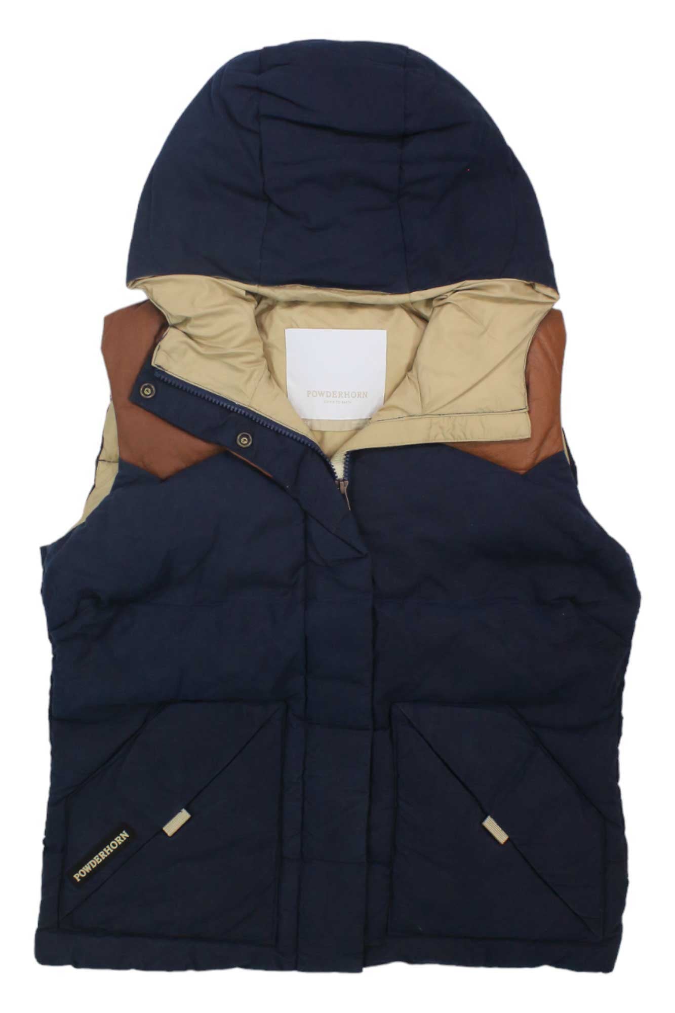 A Powderhorn Women's Jackson Vest in navy blue with water-resistant down, brown leather shoulder details, beige lining, two front pockets, and visible branding is shown flat on a white background.