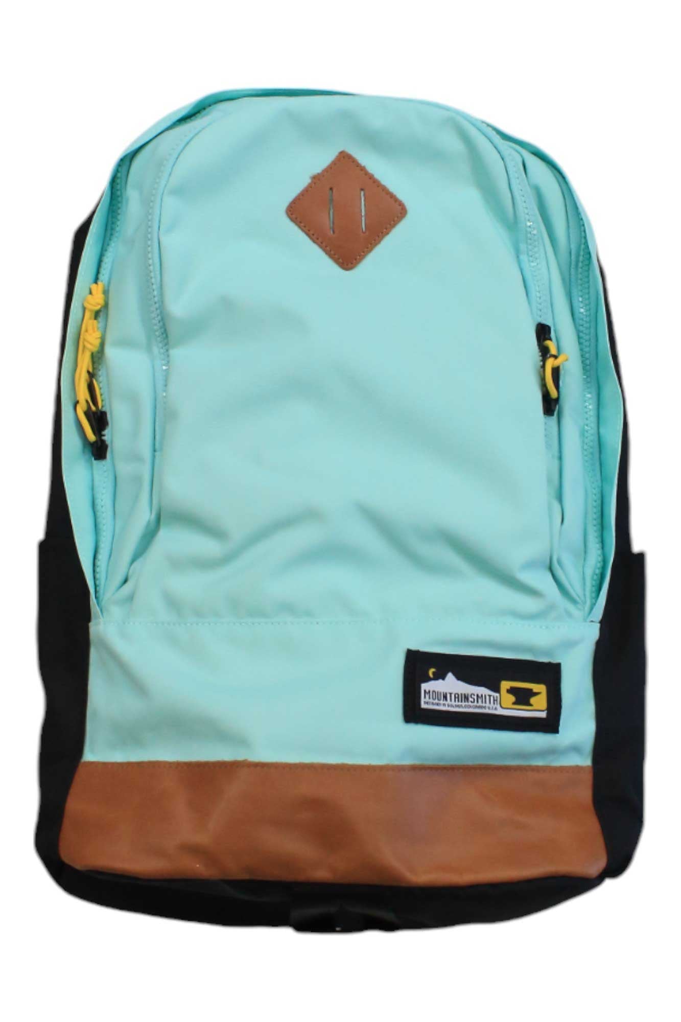 Mint Mountainsmith Trippin Pack backpack with front logo patch, zip pocket, brown base
