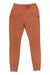 The Eddie Bauer Motion Women's High Rise Trail Tight Legging in rust offers UPF 50+ sun protection, front seams, two side zip pockets, and features a small white logo on the waistband.