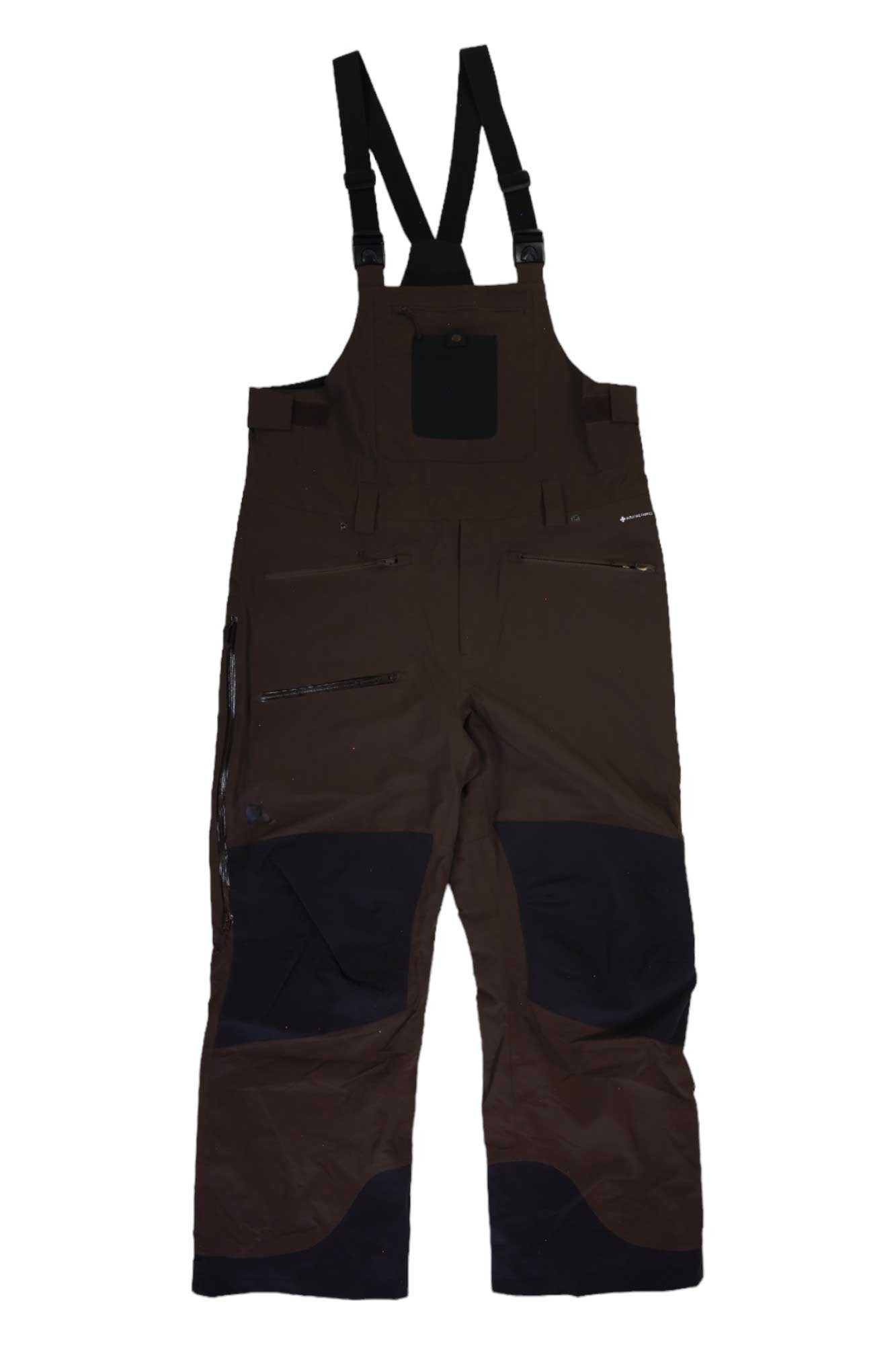 The Flylow Men's Baker Insulated Bib features black adjustable shoulder straps, zippered pockets, reinforced knee patches, and black detailing on the lower legs, shown laid flat on a white background.