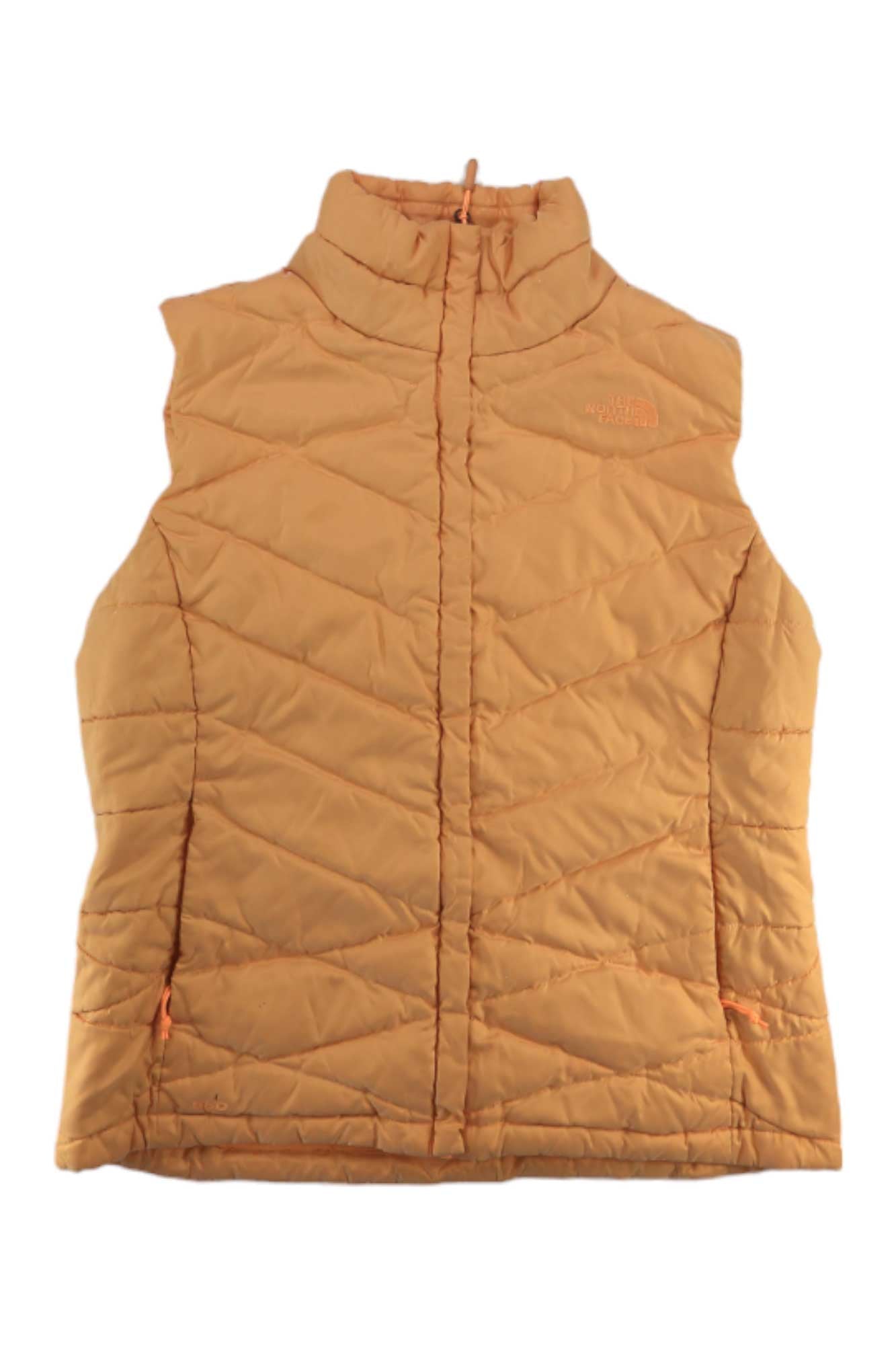 The North Face Womens Aconcagua Vest is a light orange, zip-front vest with a high collar, The North Face logo on the chest, and recycled synthetic insulation for warmth and wind resistance.