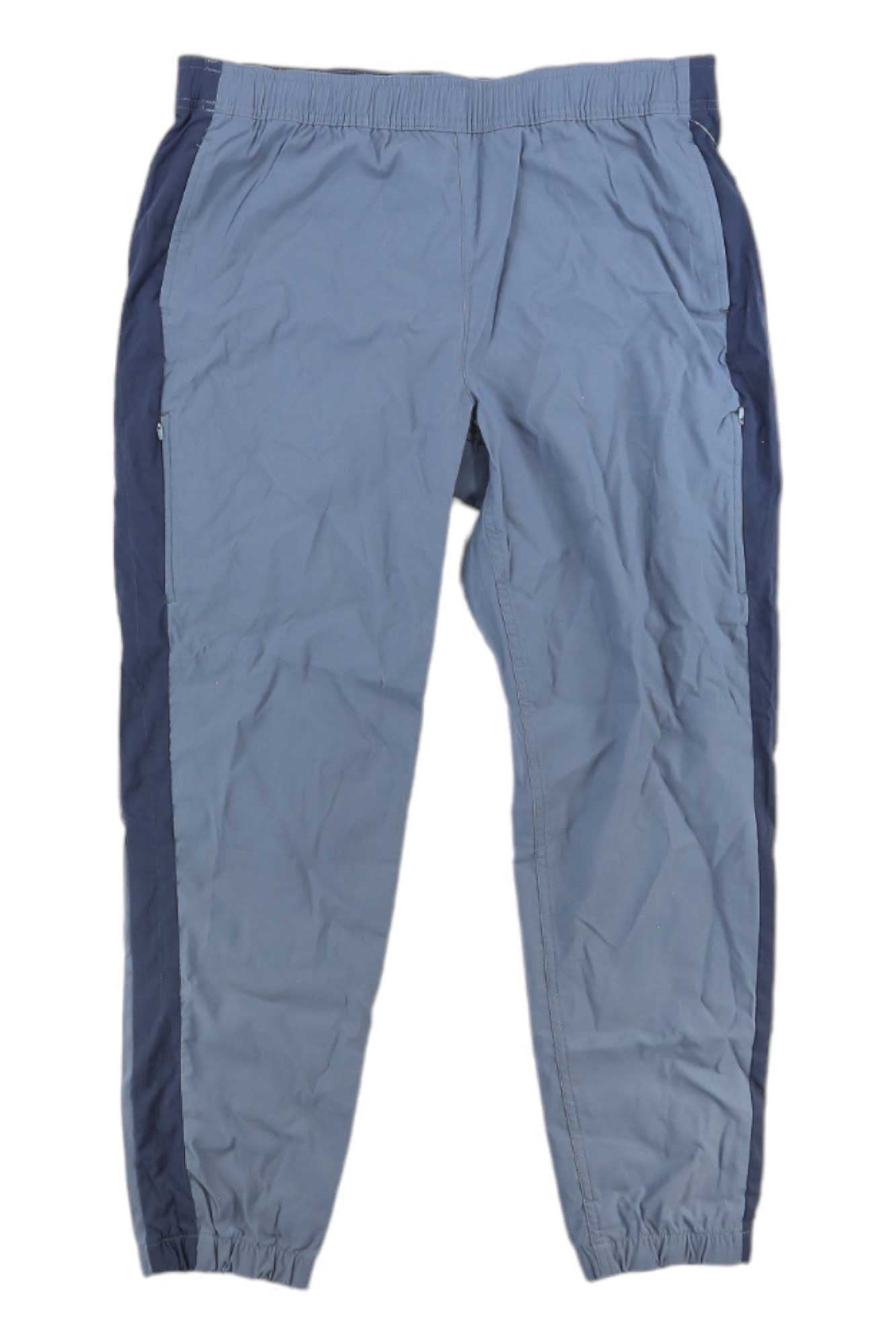 Eddie Bauer First Ascent Womens Guide Jogger in light blue with dark blue side panels features an elastic waistband, zippered side pockets, and elastic ankle cuffs. UPF 50+ fabric makes them ideal hiking pants or joggers for outdoor adventures.