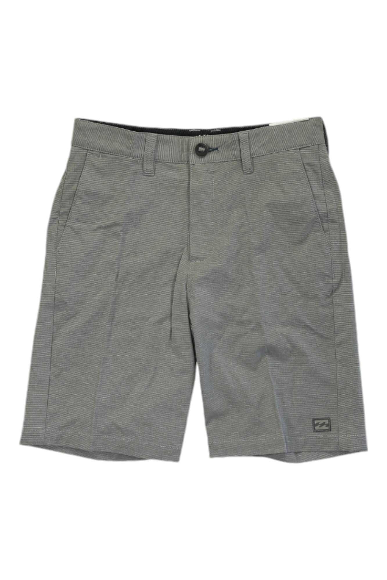 The Billabong Boys Crossfire Short features belt loops, a button and zipper closure, side pockets, a small logo patch near the left hem, and eco-conscious fabric with a subtle textured pattern in gray.