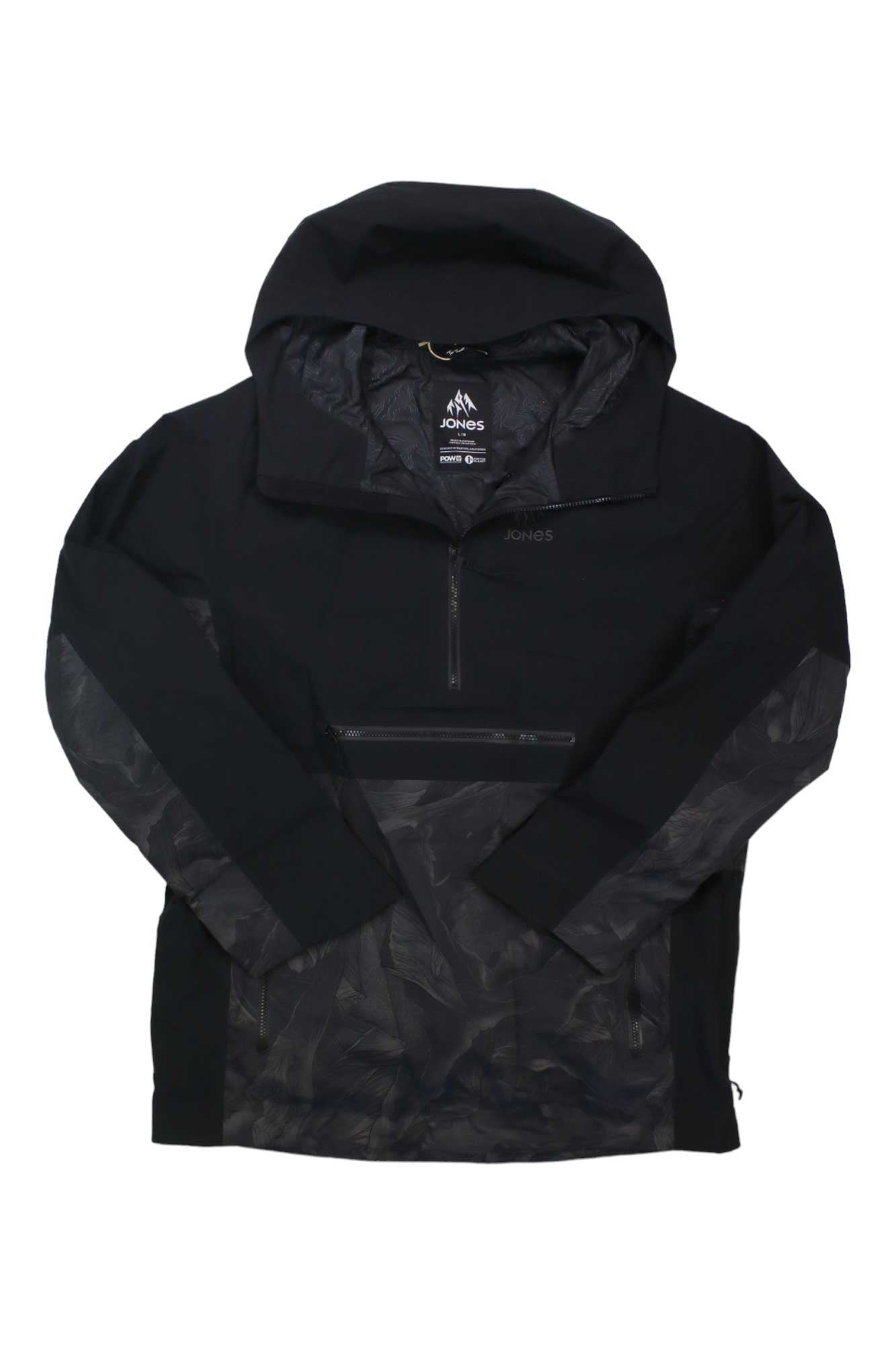 The Jones Mens MTN Surf Recycled Anorak is a black, hooded snowboard jacket featuring a half-zip front, camouflage-patterned sleeves and lower body, with the Jones logo on the chest and inside collar.