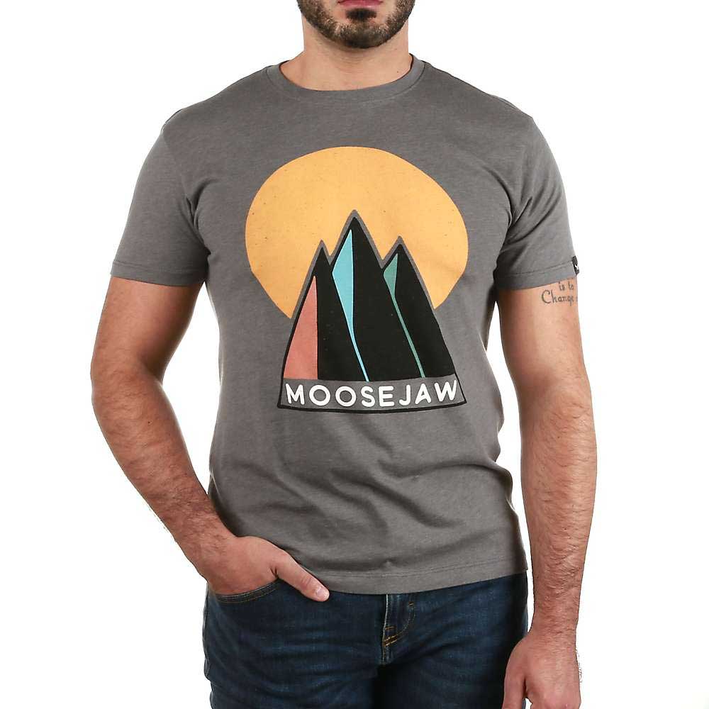 A man with a short beard, one hand in his pocket, wears the Moosejaw Mens Sunny Side Up SS Tee—a men’s organic cotton t-shirt featuring stylized mountains, a yellow sun, and "Moosejaw" on the front.