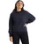 A woman with long brown hair stands confidently, wearing the Icebreaker Womens Central LS Sweatshirt in dark blue and black leggings, ready for her next travel adventure.