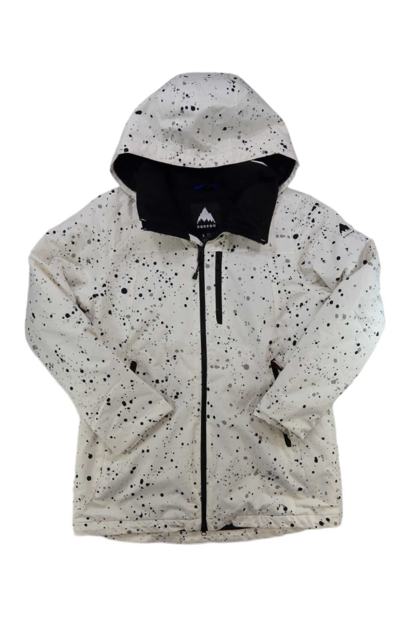 The Burton Womens Lelah Jacket is a white hooded winter jacket with black paint splatter design, black zipper, zippered chest pocket, and black-lined hood, offering an eco-friendly, casual, and artistic style.