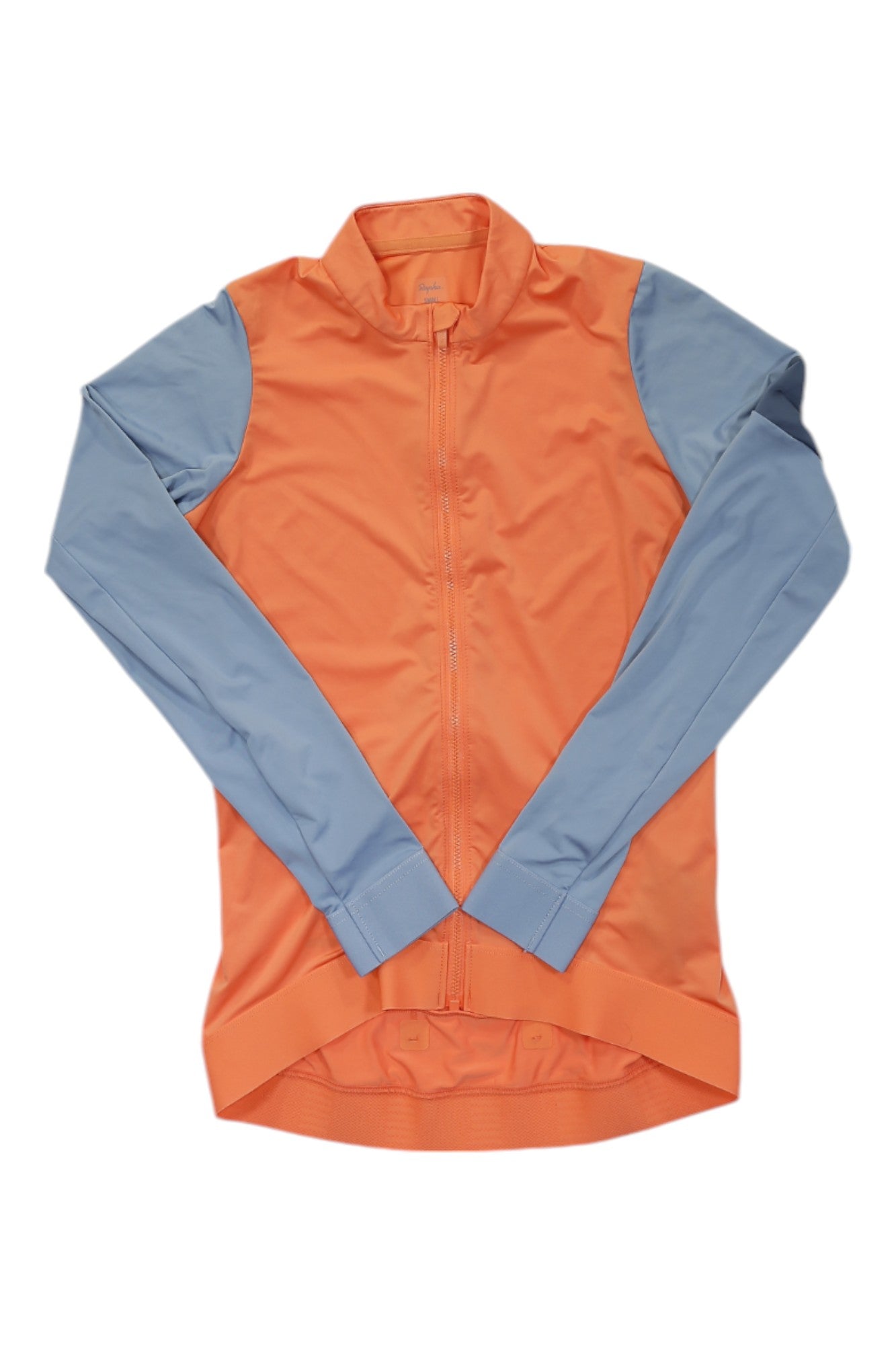 The Rapha Women's Pro Team Long Sleeve Training Jersey, with an orange body and light blue sleeves, is perfect for your next training ride. Shown laid flat on a white background.