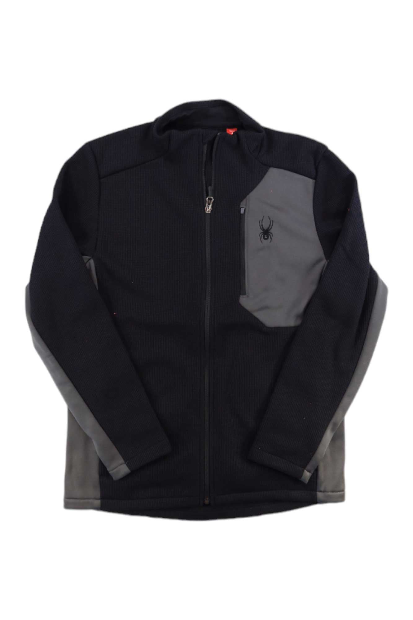 The Spyder Men's Bandit Jacket is black with gray side panels and a gray chest pocket featuring a small Spyder logo. Made from soft polyester fleece, it has long sleeves and a high collar for added warmth.
