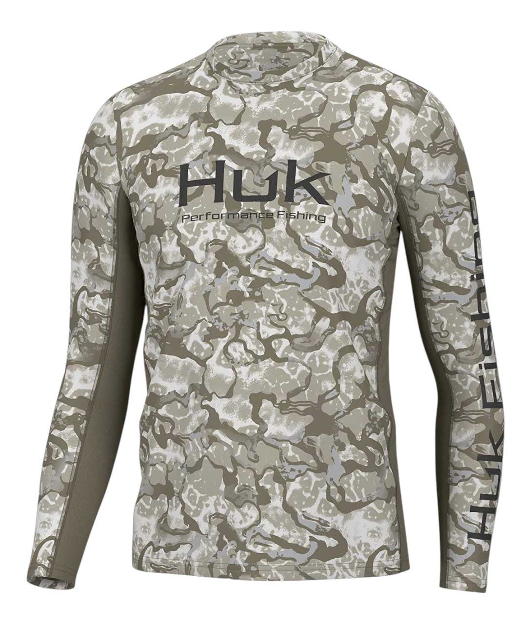 The Huk Mens Icon X Inside Reef LS Crew Top features long sleeves, a green/gray/white camouflage pattern, the Icon X logo on the chest, "Huk Fishing" text on the left sleeve, and UPF protection for outdoor comfort.