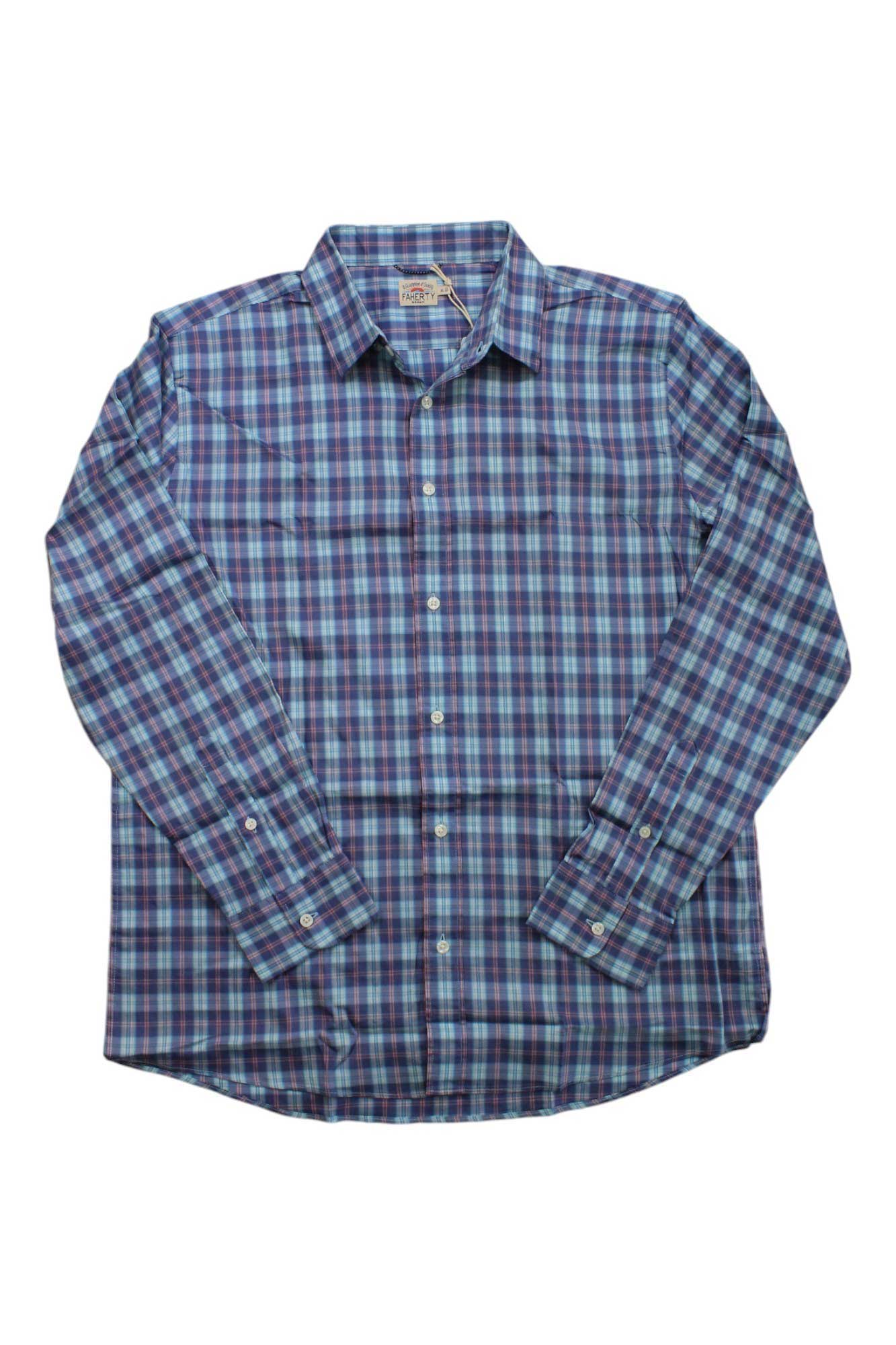 The Faherty Men's The Movement Shirt is a long-sleeve button-up travel shirt with a blue, purple, and white plaid pattern, shown laid flat on a white background. It offers moisture wicking for all-day comfort.
