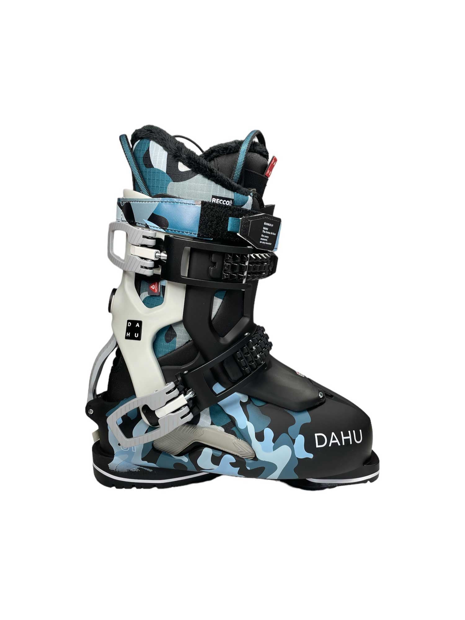 The Dahu Womens Ecorce 01 W90 Flex Ski Boot features a blue, black, and white camo pattern, Grilamid shell, black straps, metal buckles, and "DAHU" printed in white on the toe.