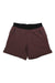 The Janji Men's 7 Inch AFO Traverse 2-in-1 Short in maroon features a black elastic waistband, zippered side pockets, and a built-in compression liner, shown laid flat on a white background.
