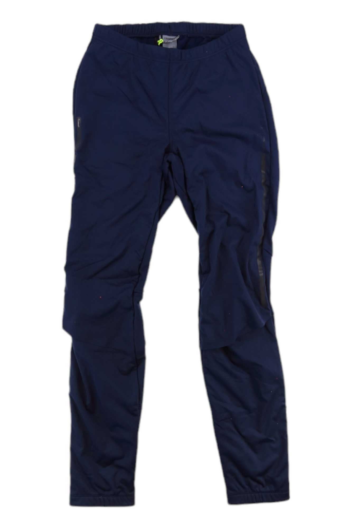 The Craft Sportswear Womens Storm Balance Tights in navy blue feature an elastic waistband, tapered legs, and moisture-wicking comfort, shown laid flat on a white background.