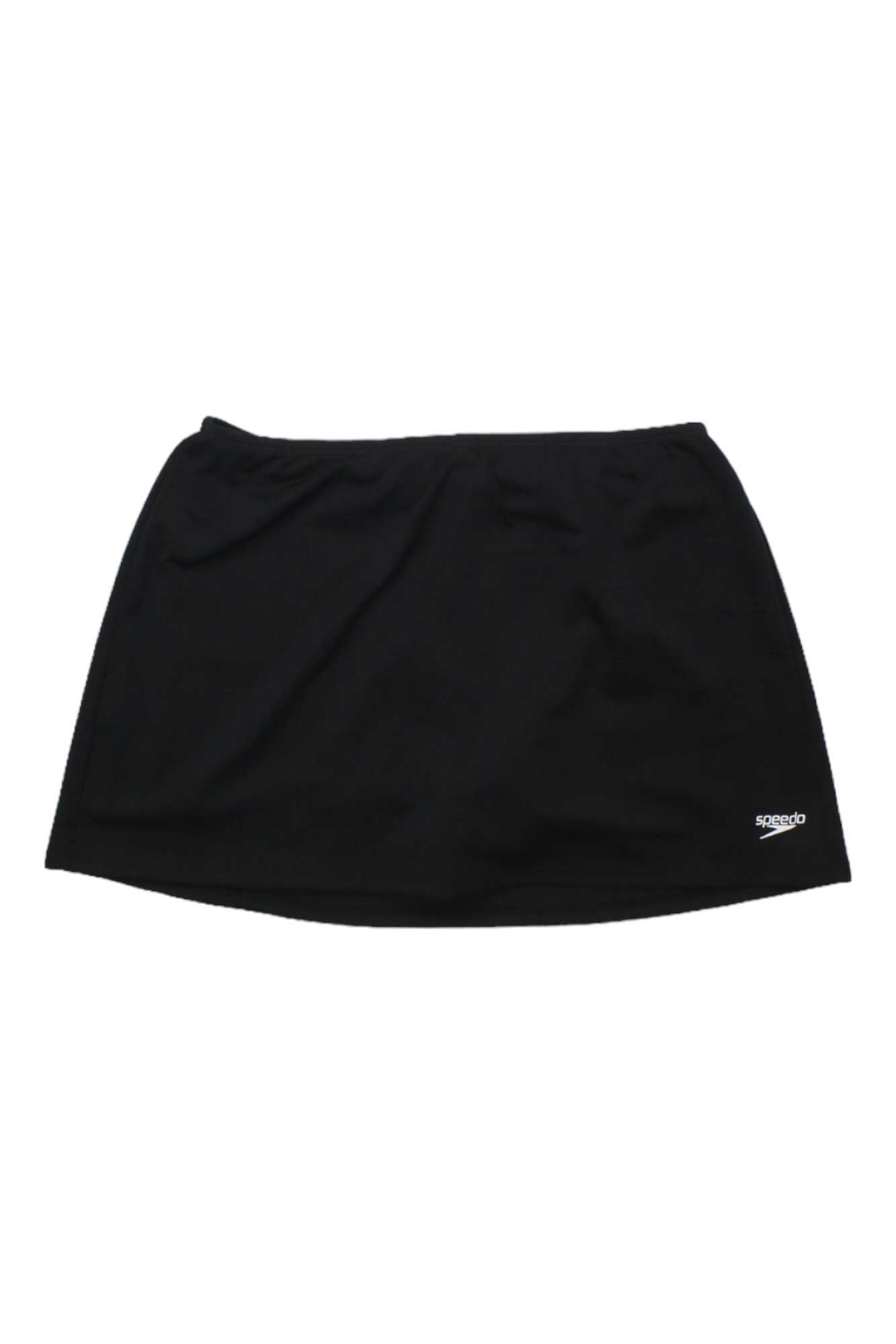 The Speedo Womens Swim Skirt with Compression Short is a plain black athletic swim skirt featuring a built-in compression short, UPF 50+ protection, and a small white Speedo logo on the lower right side, shown against a white background.