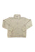 The Womens Roice 1/2 Zip is a light beige, long-sleeve fleece pullover with a quilted design, half-zip front, stand-up collar, ribbed cuffs, eco-friendly fabric, and subtle lower-front logo—perfect as a cozy hiking shirt.